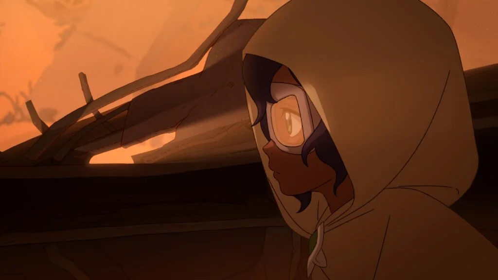 A hooded character with goggles stands beside wooden structures in orange light